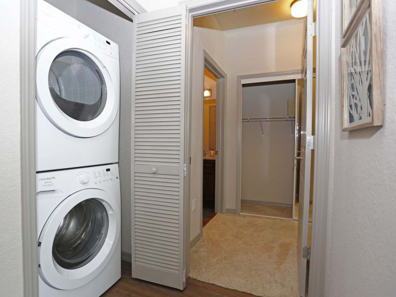 This image featured the Stacked Energy Star washer and dryer. It's spacious and has an access door to get in and out.