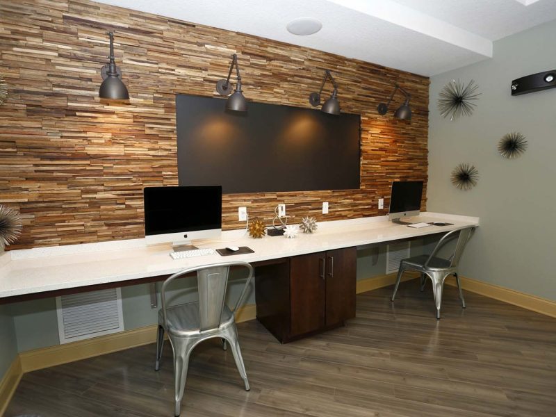 This image shows the clubhouse featuring the café lounge with apple computers.